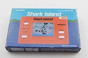 MISC: 1983 TANDY: SHARK ISLAND HANDHELD