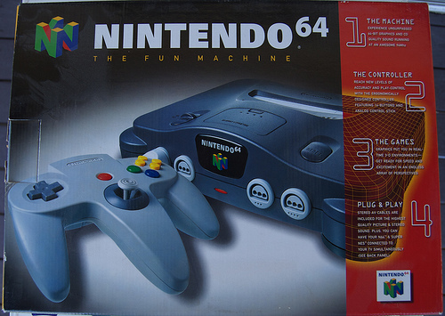 N64: CONSOLE - BLACK - 1 CTR; AV; AC ADAPTAR AND JMP. PACK (USED) - Click Image to Close